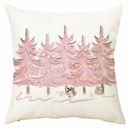 Pink Christmas trees pillow cover with string lights and wrapped presents in a watercolor holiday design