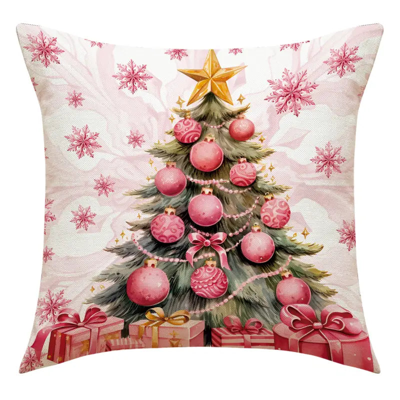 Pink Christmas tree pillow cover with ornaments, garland, star topper, and wrapped presents in a holiday design