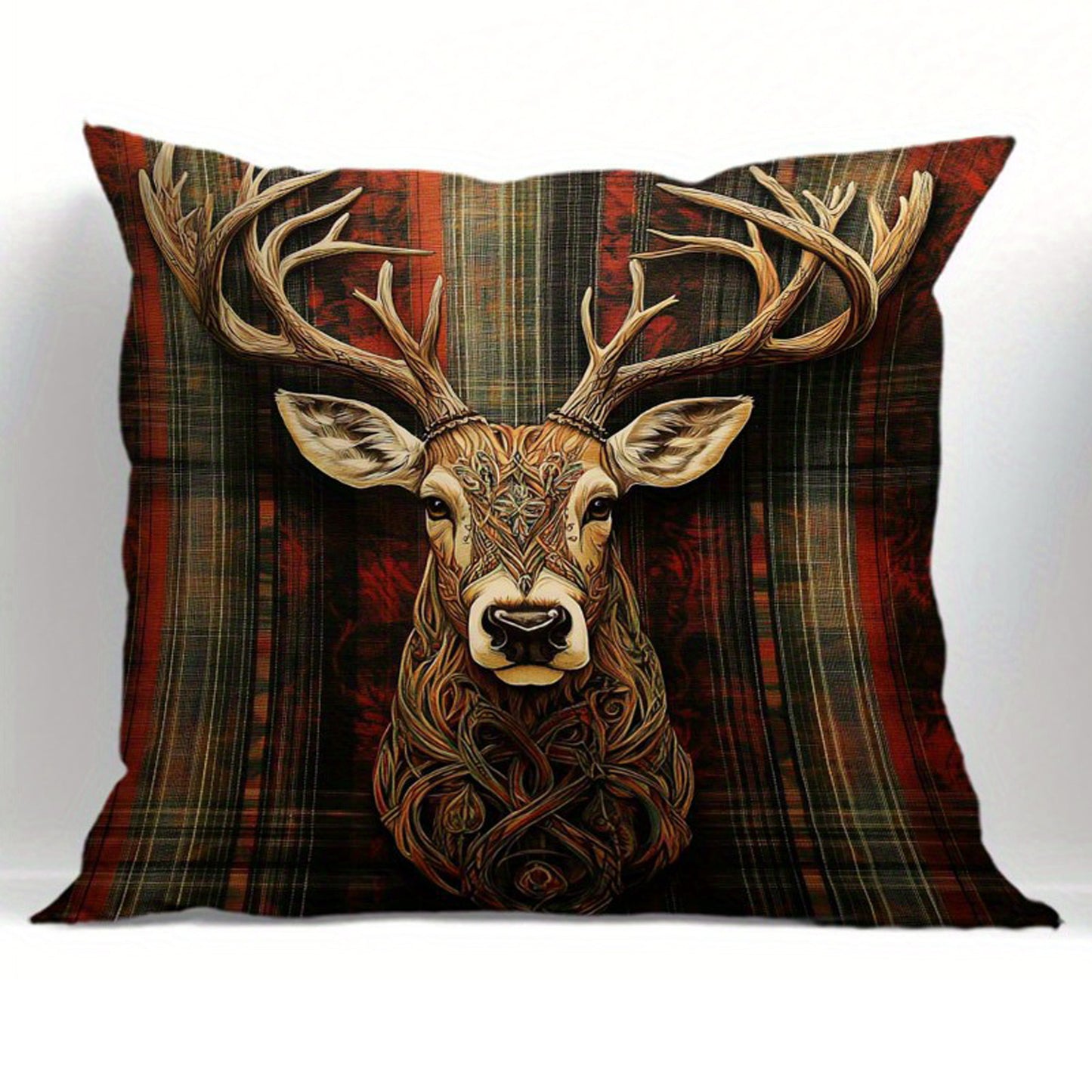 Deer pillow cover with centered stag illustration and Celtic knot detailing on a red plaid background.