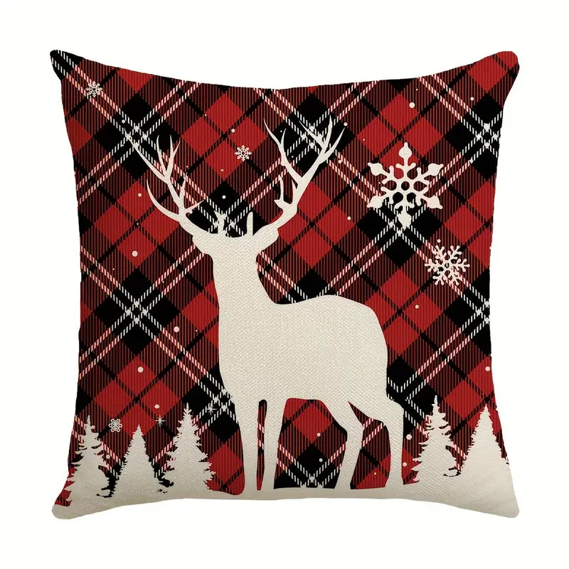Red and black plaid Christmas pillow cover with white deer silhouette and snowflakes