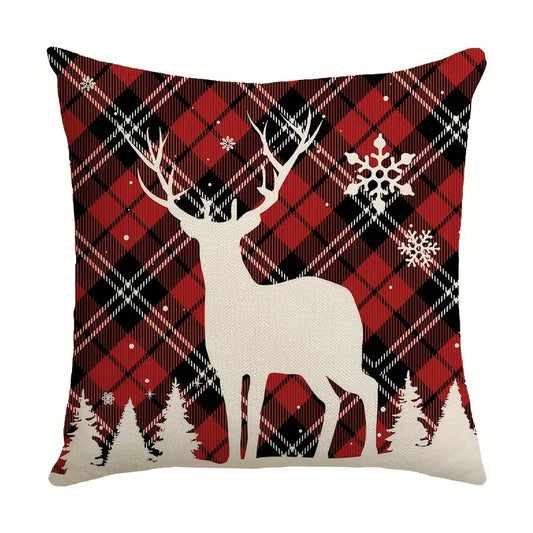 Red and black plaid Christmas pillow cover with white deer silhouette and snowflakes