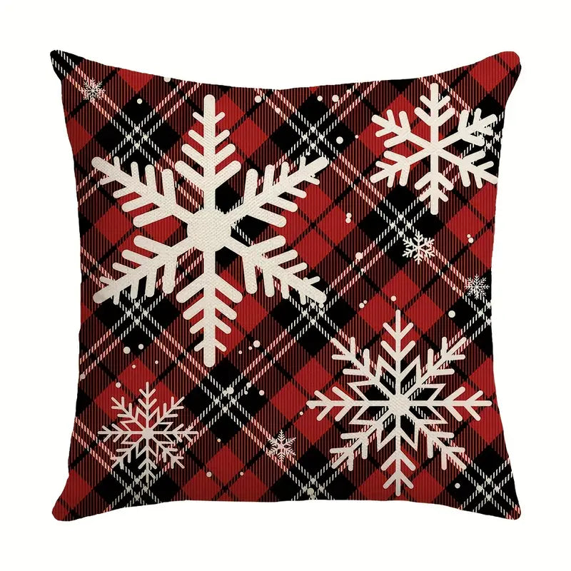 Red and black plaid Christmas pillow cover with white snowflakes on buffalo plaid background
