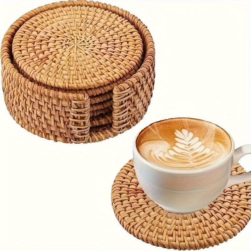 Hand woven rattan coasters stacked in a woven holder with a coffee cup on a rattan coaster.