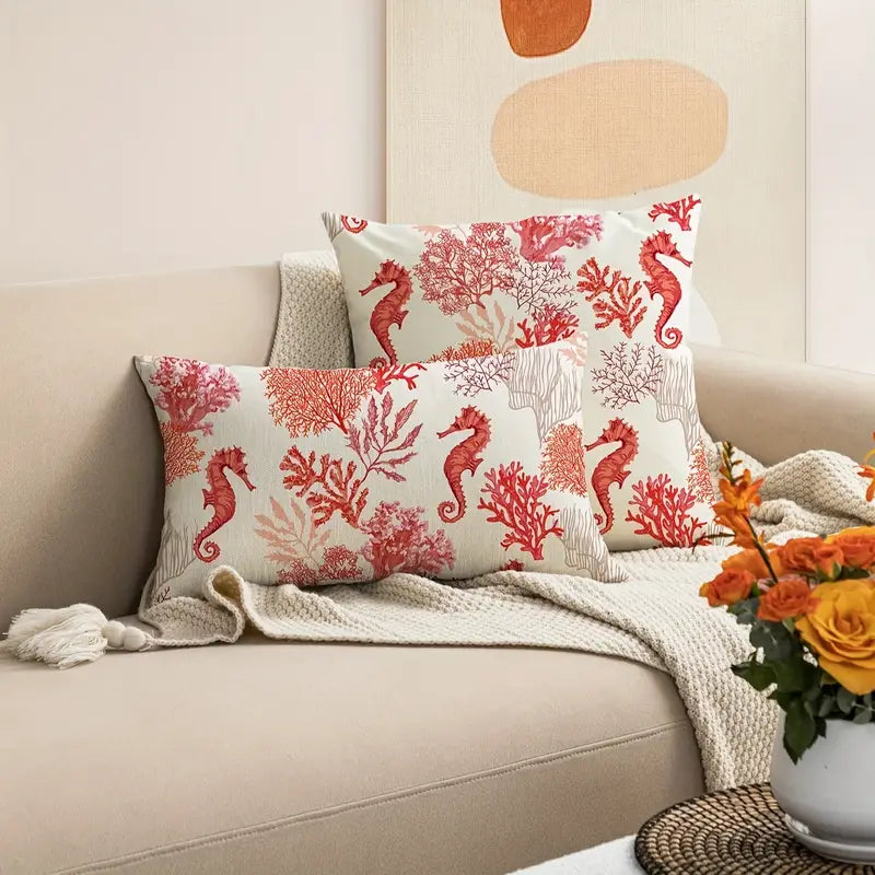 Coordinated set including one 18"x18" square and one 12"x20" lumbar linen pillow cover in a red seahorse and coral pattern.