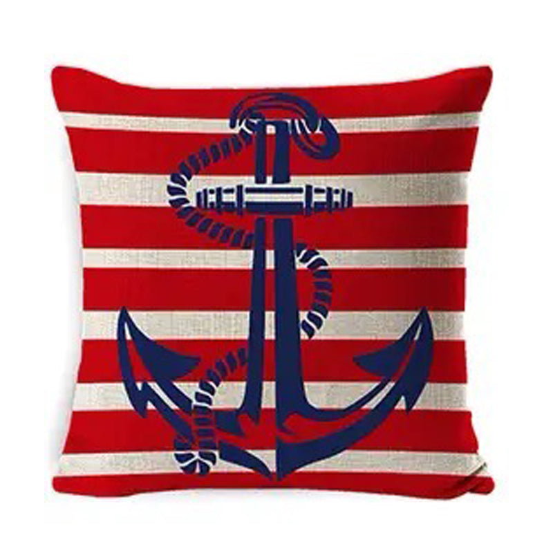 Linen pillow cover featuring a centered anchor over red and navy vertical stripes with nautical-themed script accents.