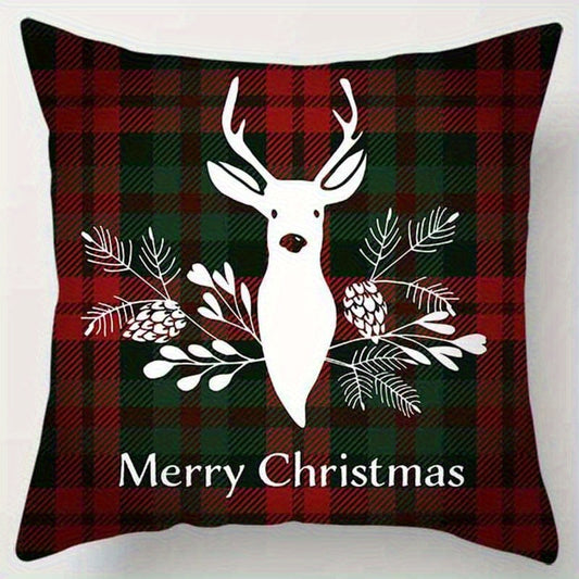 Red and green plaid pillow cover with a reindeer and greenery design