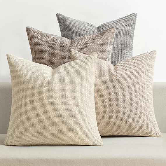 Atmospheric 18x18 inch pillow covers in sandstone, driftwood, taupe, and slate showing a dense woven grid pattern for coastal décor – Coastal Pillows Plus.