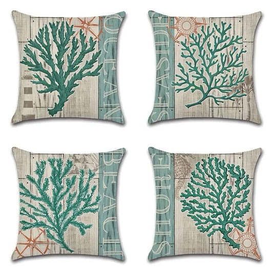 Set of four pillow covers featuring different teal coral designs on a weathered wood-style coastal background.