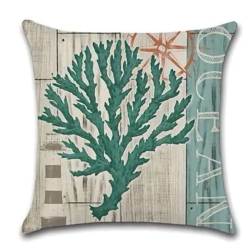 Pillow cover featuring a wide branching teal coral design on a weathered wood-style coastal background.