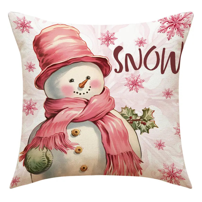 Pink snowman pillow cover with snowflakes and the word SNOW in a pastel Christmas winter design