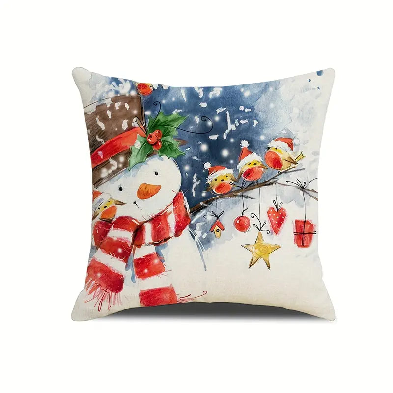 Snowman pillow cover with birds on a snowy branch and hanging ornaments in a winter watercolor scene