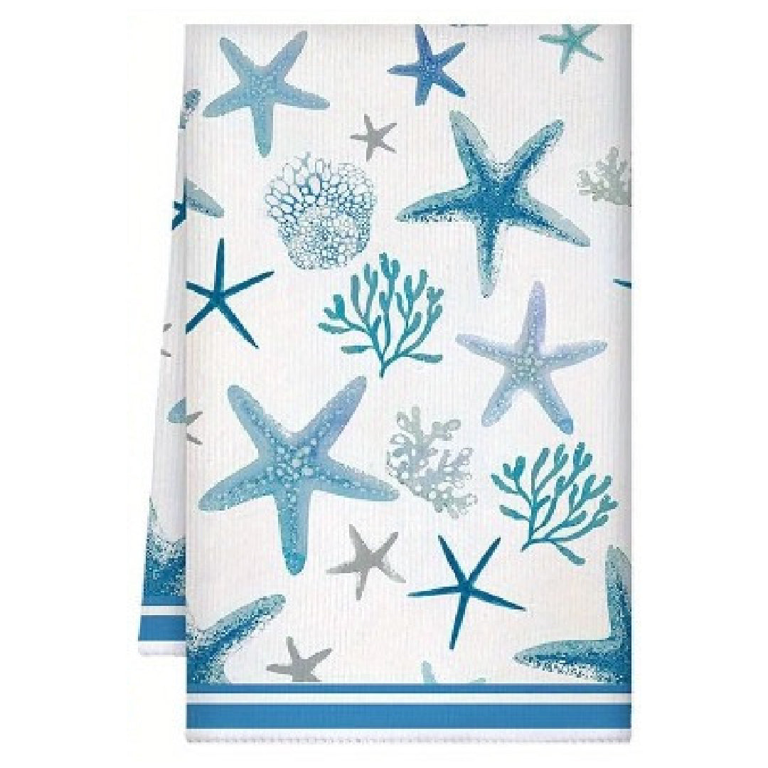 Towel with blue starfish and coral pattern on a white background