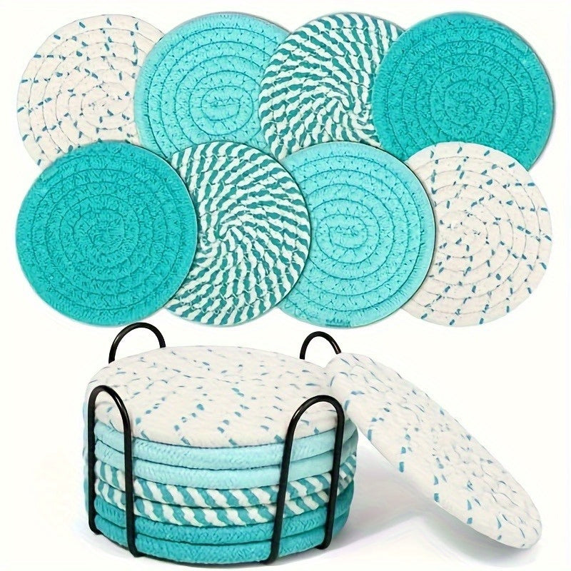 Round teal and white woven coasters stacked in a black metal holder with mixed blue and turquoise patterns.