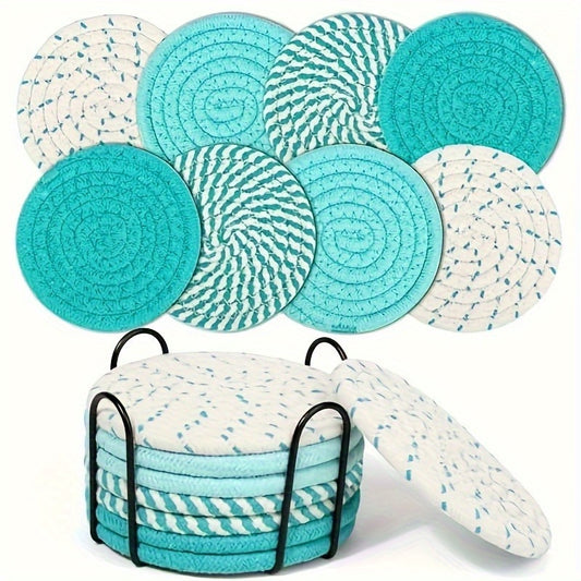 Round teal and white woven coasters stacked in a black metal holder with mixed blue and turquoise patterns.