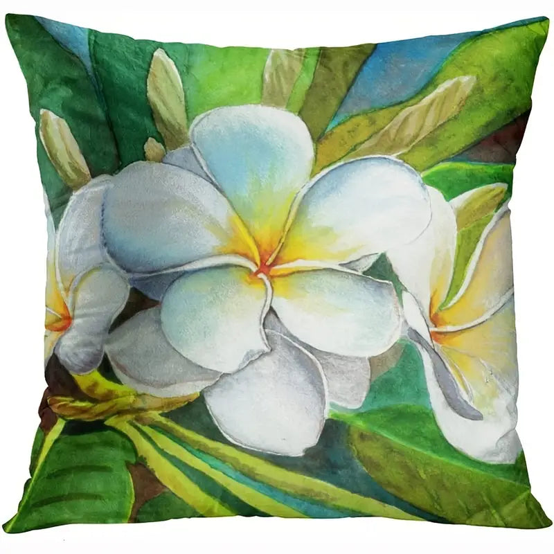 Decorative pillow cover featuring a large white tropical flower with yellow center against green leaves.