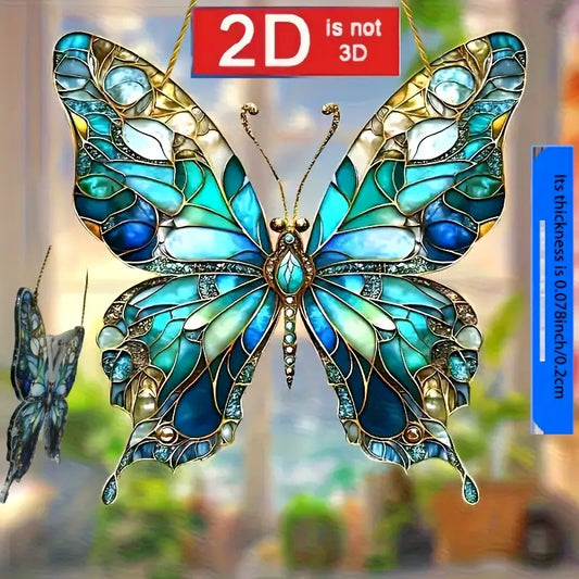 Turquoise and gold butterfly acrylic stained glass style suncatcher hanging in a window.