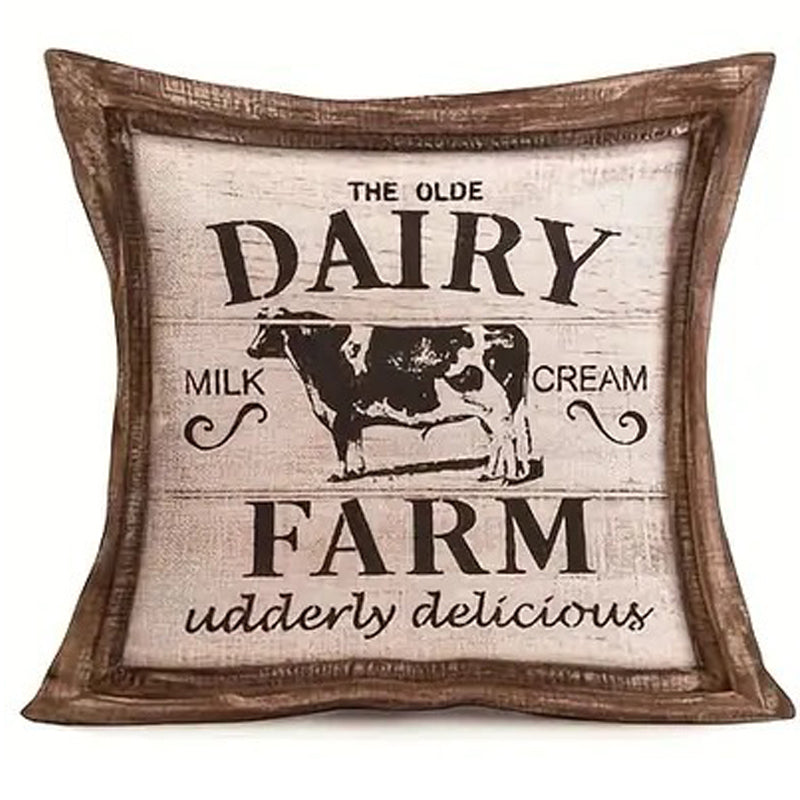 Linen pillow cover featuring a vintage Olde Dairy Farm sign with cow illustration and wood-look framed border.