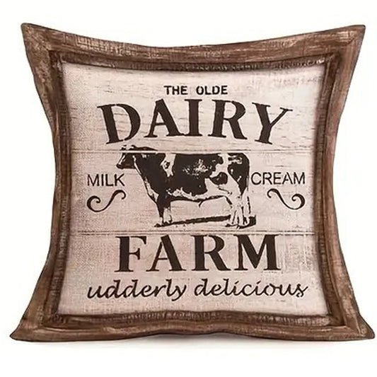 Linen pillow cover featuring a vintage Olde Dairy Farm sign with cow illustration and wood-look framed border.