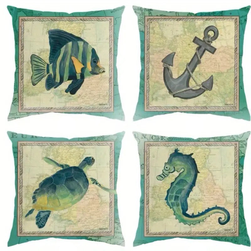 Set of four pillow covers featuring fish, anchor, turtle, and seahorse illustrations on a vintage map-style background.