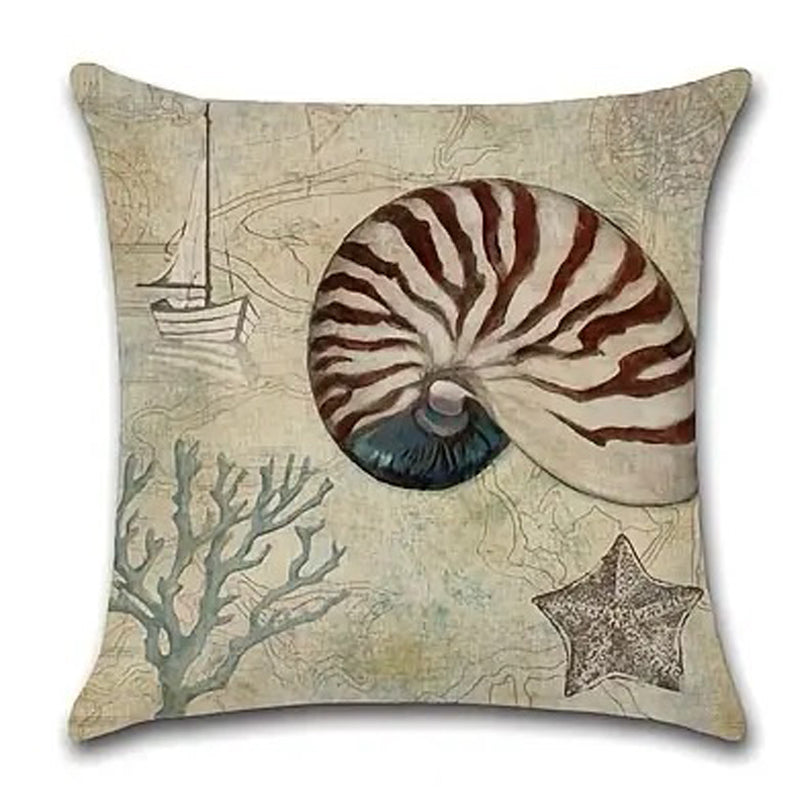 Linen pillow cover featuring a large nautilus shell with starfish and coral accents on a parchment-style nautical map background.