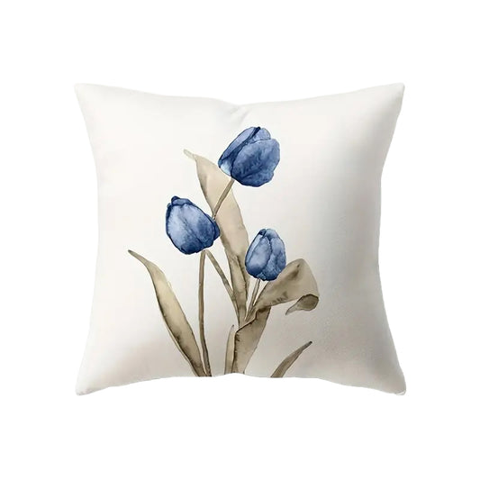 Illustrative 18x18 inch pillow cover featuring three watercolor-style blue Tulips with flowing tan leaves on a white background, styled on a sofa for spring décor – Coastal Pillows Plus.