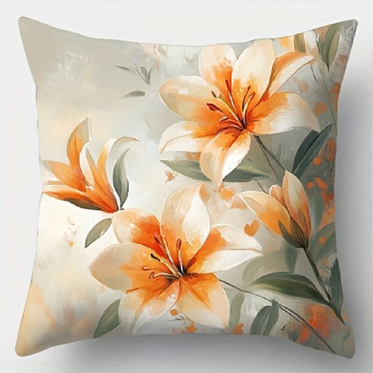 Floral pillow cover featuring a centered arrangement of orange and white lilies with soft green leaves in a watercolor-style design, shown on a white background.