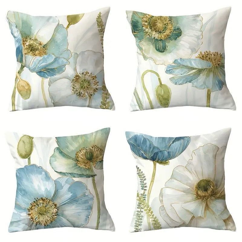Set of four decorative pillow covers featuring soft blue and white watercolor poppy flowers with green stems on a light background.