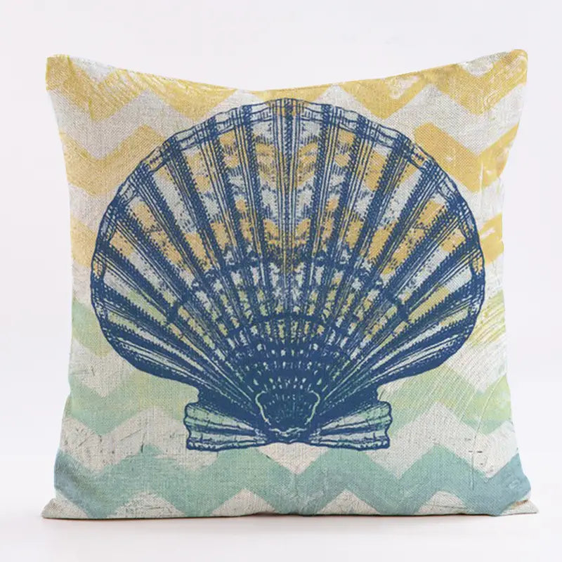 18"x18" linen pillow cover featuring a large watercolor scallop shell over a soft yellow and seafoam chevron background.