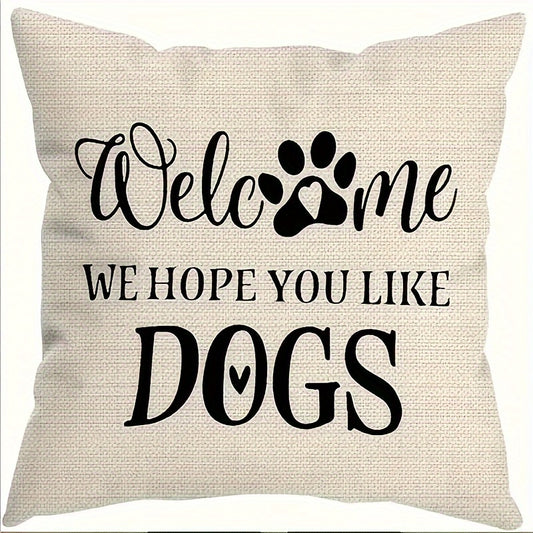 Decorative pillow with text 'Welcome, we hope you like dogs' on a beige background