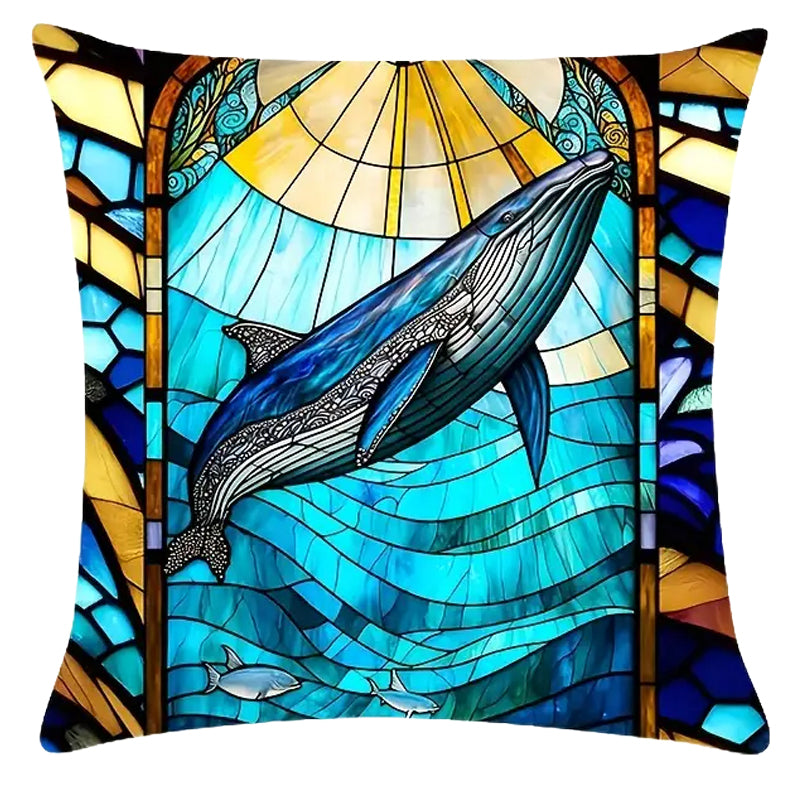 Square pillow cover featuring a large whale swimming above layered ocean waves with a radiant sun and stained-glass-style framing in blue and gold tones.