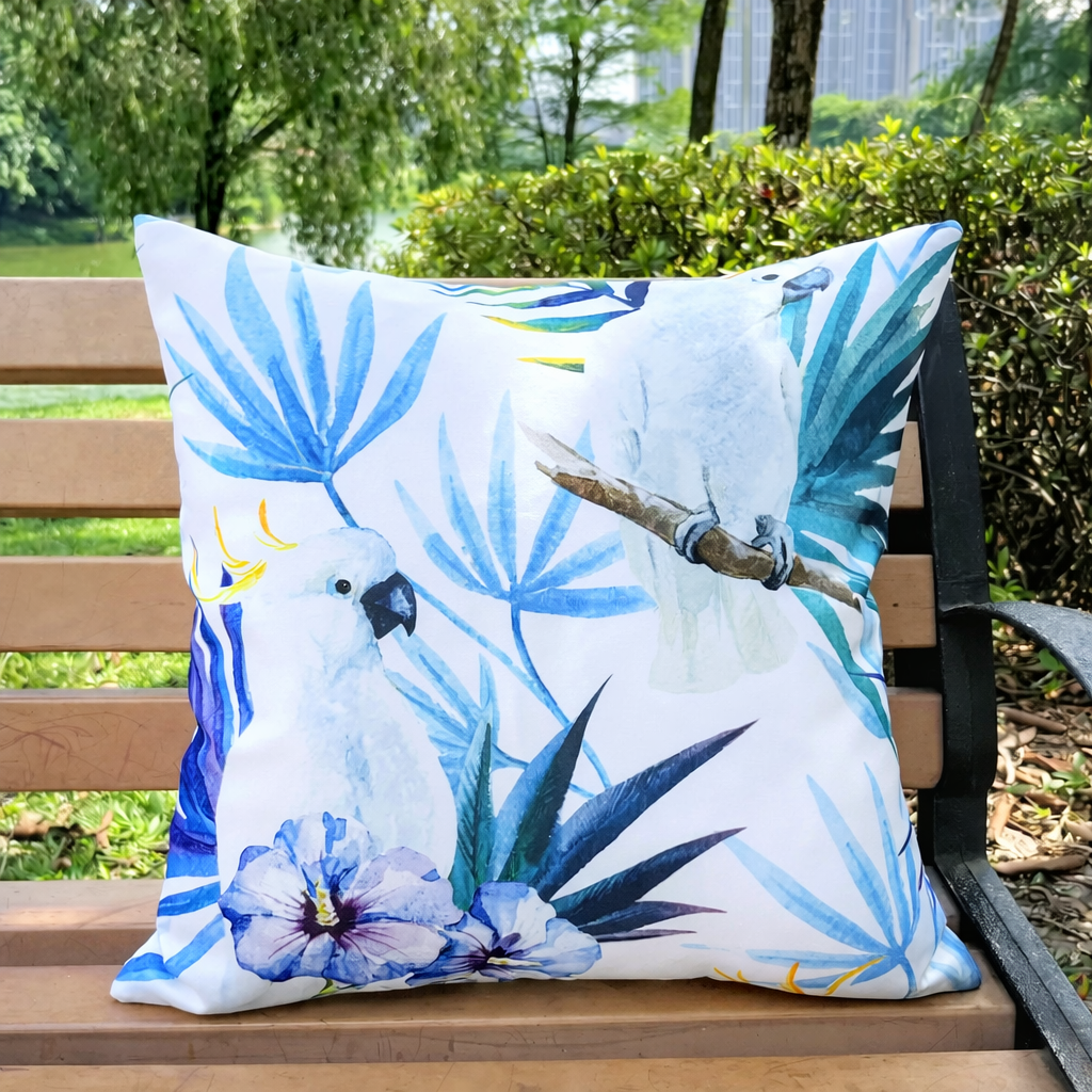 White parrot outdoor pillow cover with blue tropical leaves on white background, 18x18, waterproof.