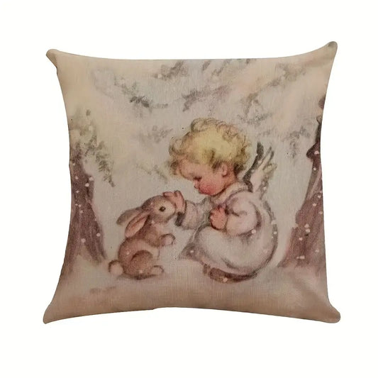 Winter pillow cover featuring a small angel with wings kneeling beside a bunny in a snowy forest scene.