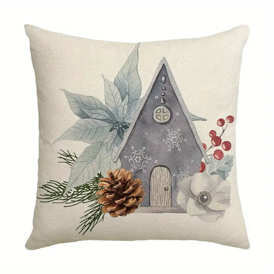 Winter pillow cover with birdhouse, pinecone, greenery, and berries on a neutral background