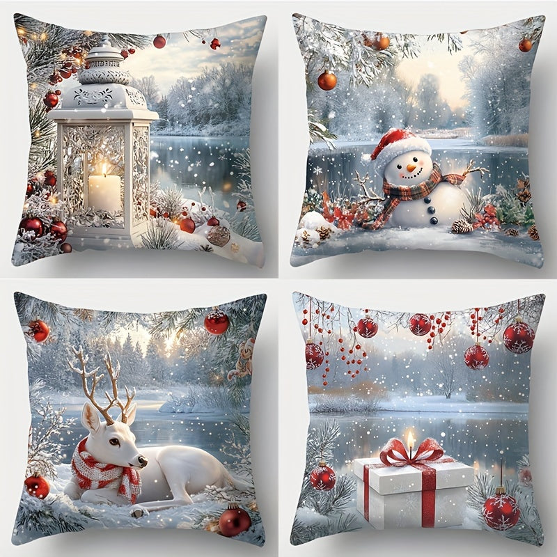 Set of four pillow covers featuring winter scenes with lantern, snowman, reindeer, and wrapped gift in snowy landscapes