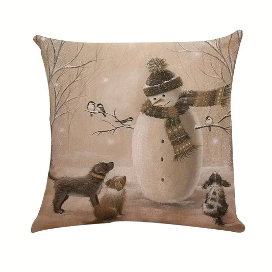 Winter pillow cover featuring a snowman with scarf and small dogs in a snowy forest scene.