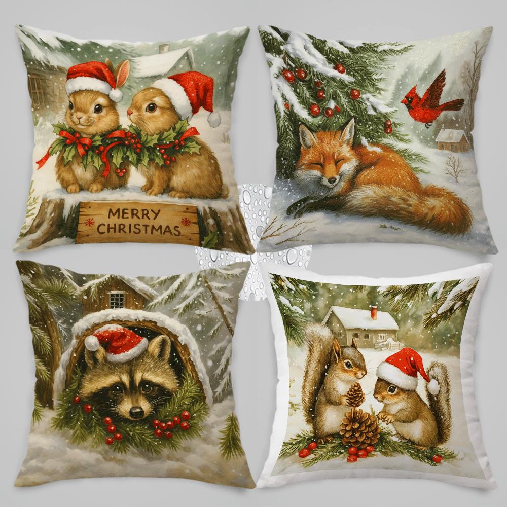 Set of four pillow covers featuring rabbits, fox, raccoon, and squirrels in snowy winter scenes with Christmas hats and greenery