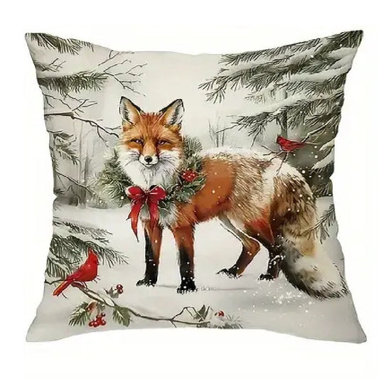 Winter pillow cover featuring a fox standing in a snowy forest scene with winter greenery and red berries.
