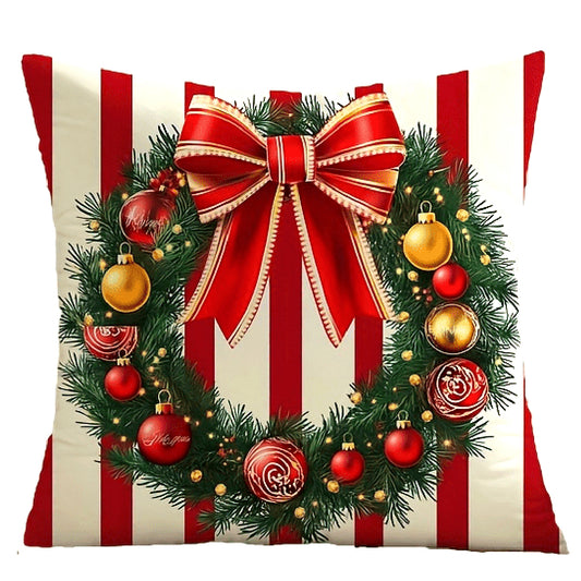 Red and white striped pillow cover with a wreath and ribbon bow