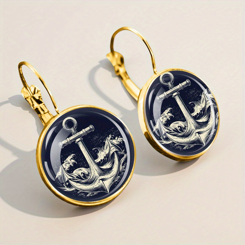 Classic golden alloy anchor earrings featuring dark blue and white glass for a traditional nautical décor.