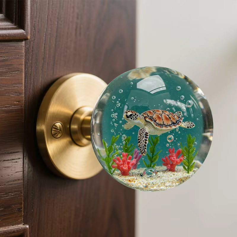 Vintage nautical resin door knob with a 3D sea turtle design in a clear globe, adding a touch of coastal charm to home décor.