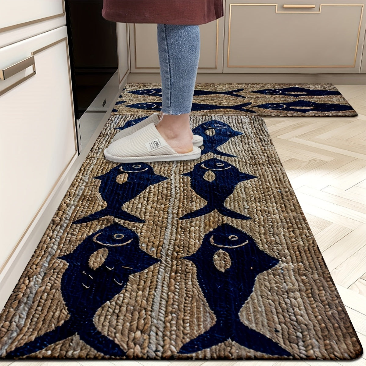 Absorbent flannel polyester coastal-style rectangular sponge mat with blue fish pattern on textured light wood-grain background, styled on the floor for bathroom or kitchen décor – Coastal Pillows Plus.