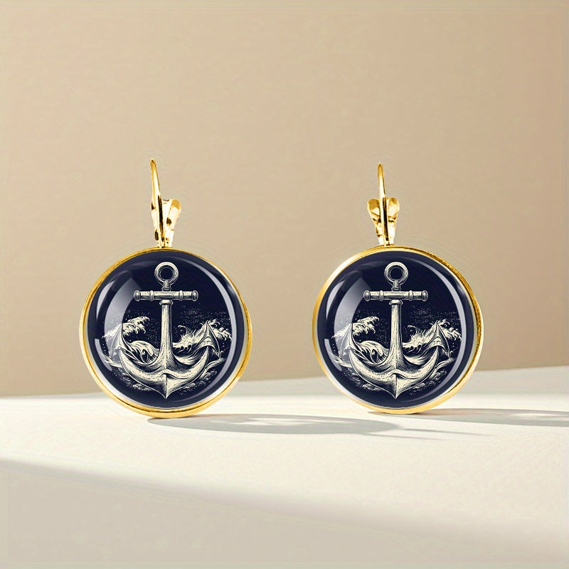 Classic golden alloy anchor earrings featuring dark blue and white glass for a traditional nautical décor.
