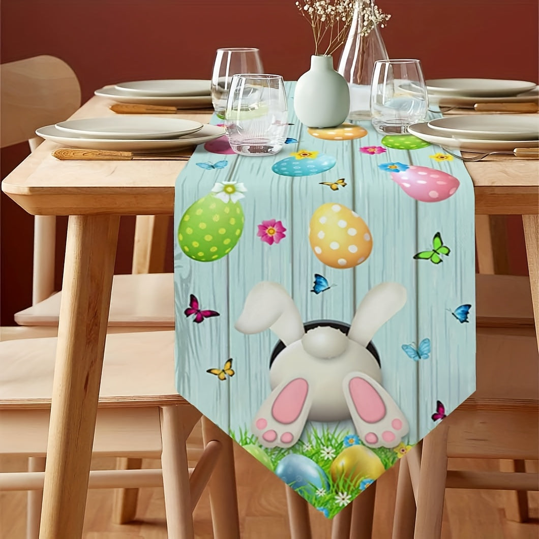 Fetching 13x90 inch triangular Easter table runner featuring a bunny bottom diving into a hole, with eggs and butterflies on a blue wood-grain background, styled on a table for spring holiday décor – Coastal Pillows Plus