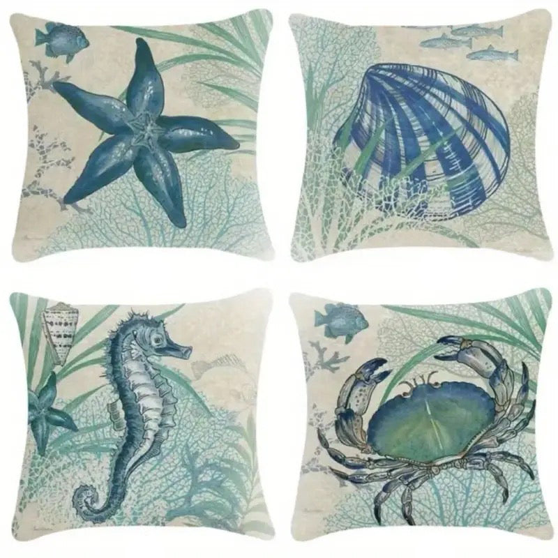 Set of four pillow covers featuring starfish, shell, seahorse, and crab designs in teal and blue coastal tones.